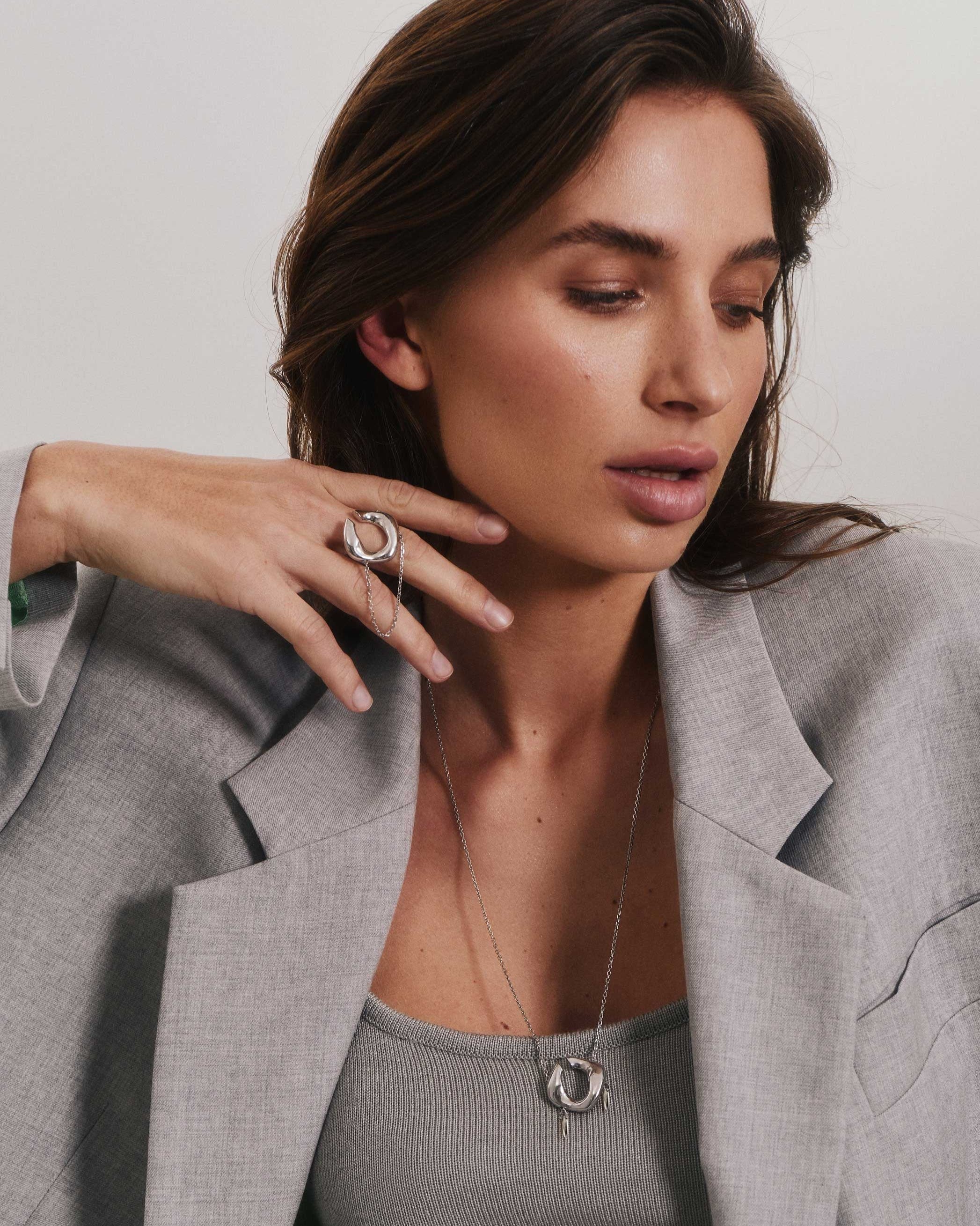 Silver set of transforming jewelry on girl