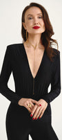 Woman in long gold necklace and asymmetric earrings