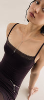 Girl in thin silver loose necklace with beads 