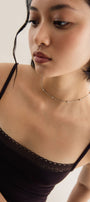 Girl in delicate beaded silver choker