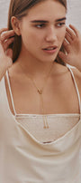 Girl in a set of minimalist gold transforming jewelry
