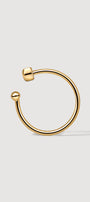 Gold thin ear cuff on the white background