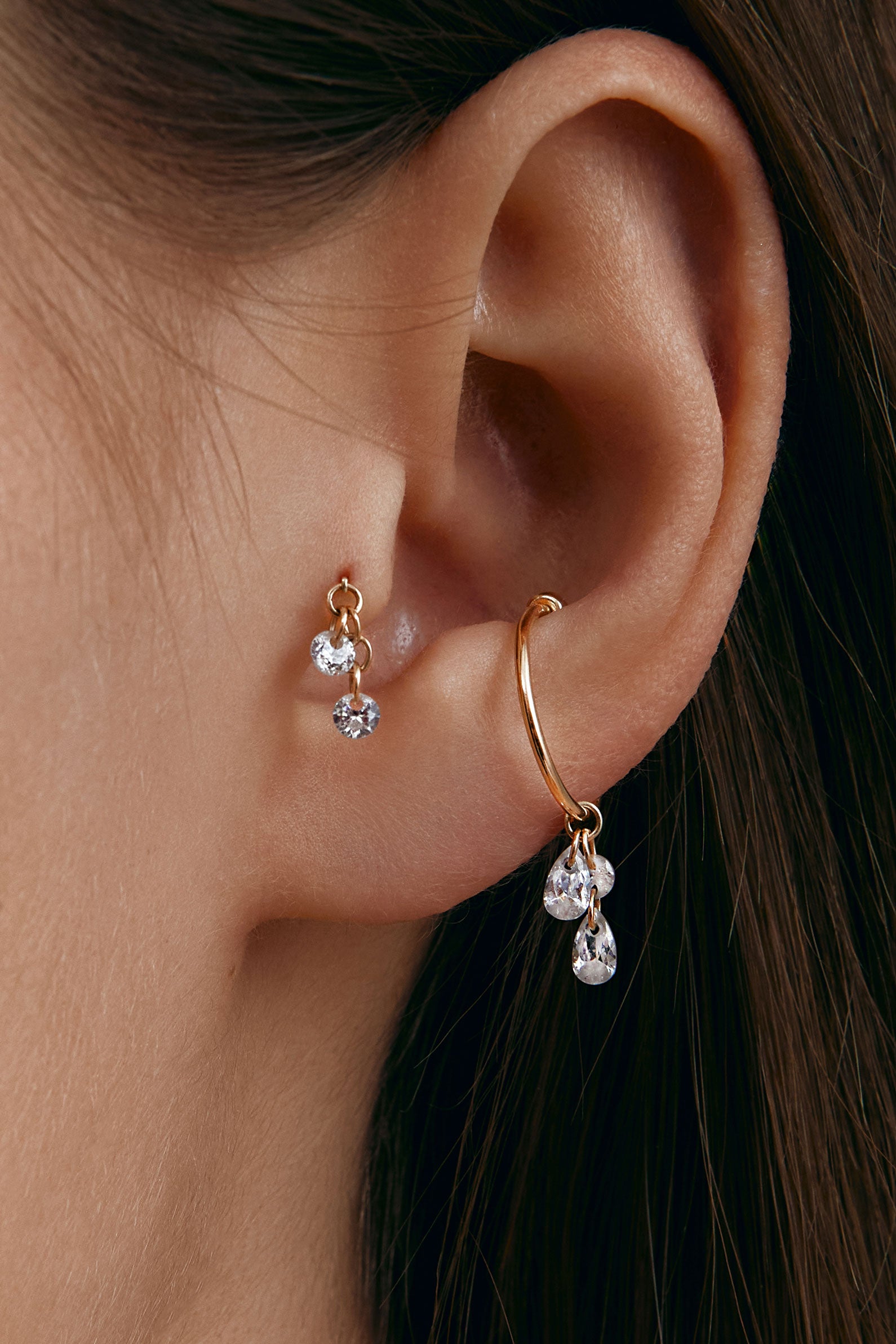 Gold ear cuff with gems & tragus earring with gems on the ear
