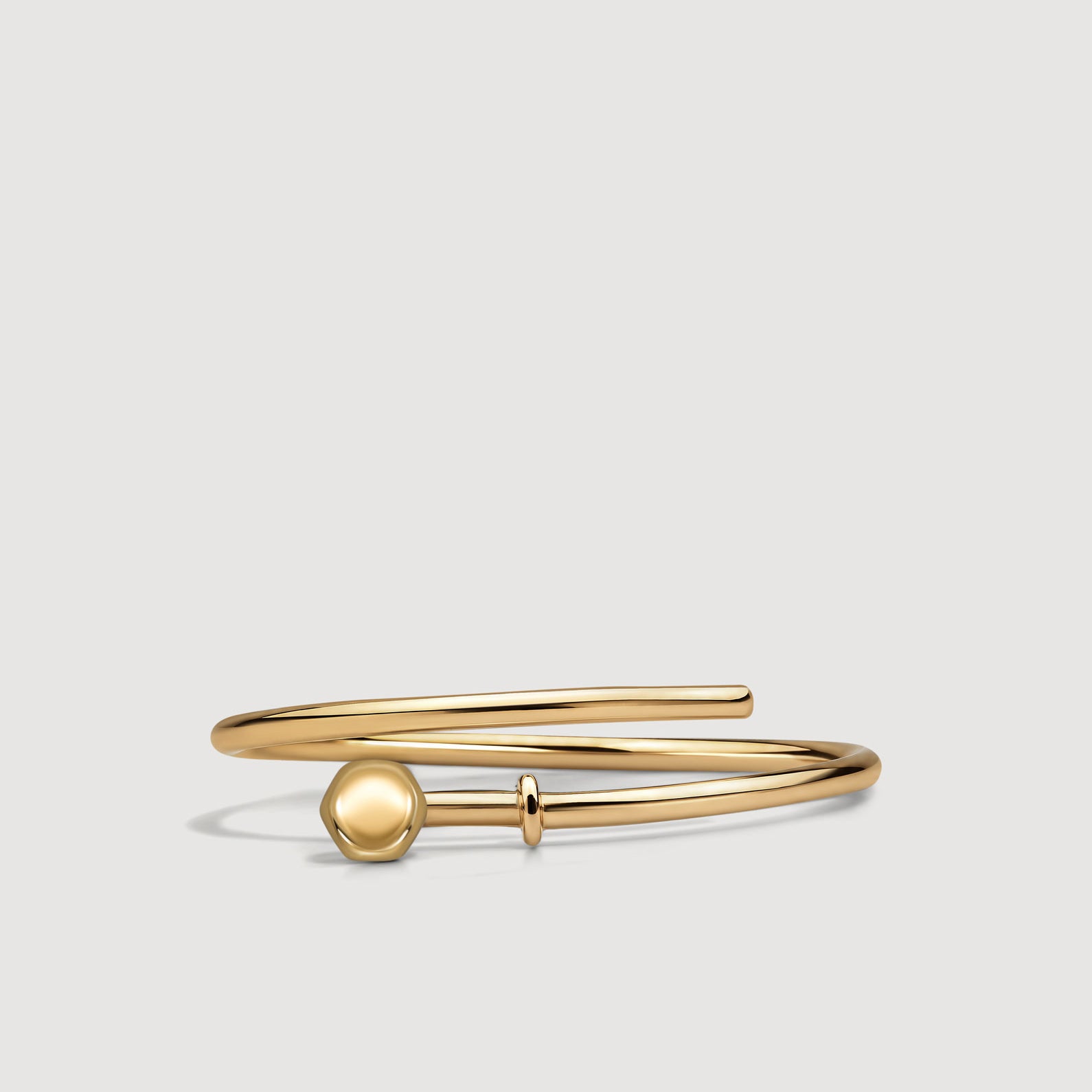 Gold open ring on a white background
