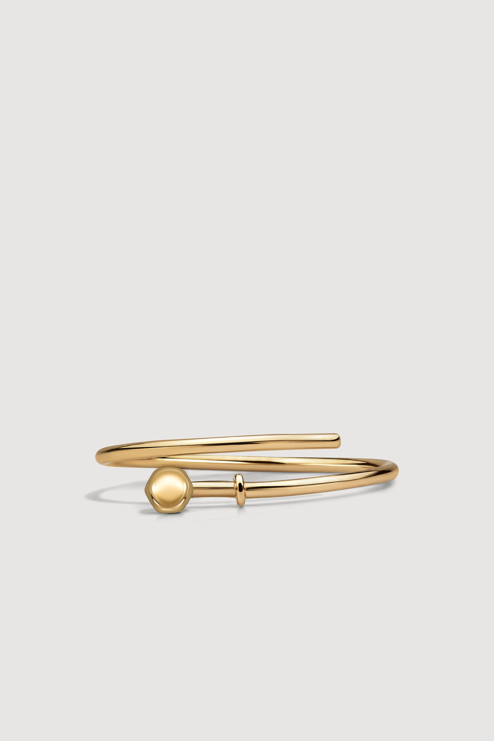 Gold open ring on a white background