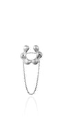 Silver ring with chain on a white background