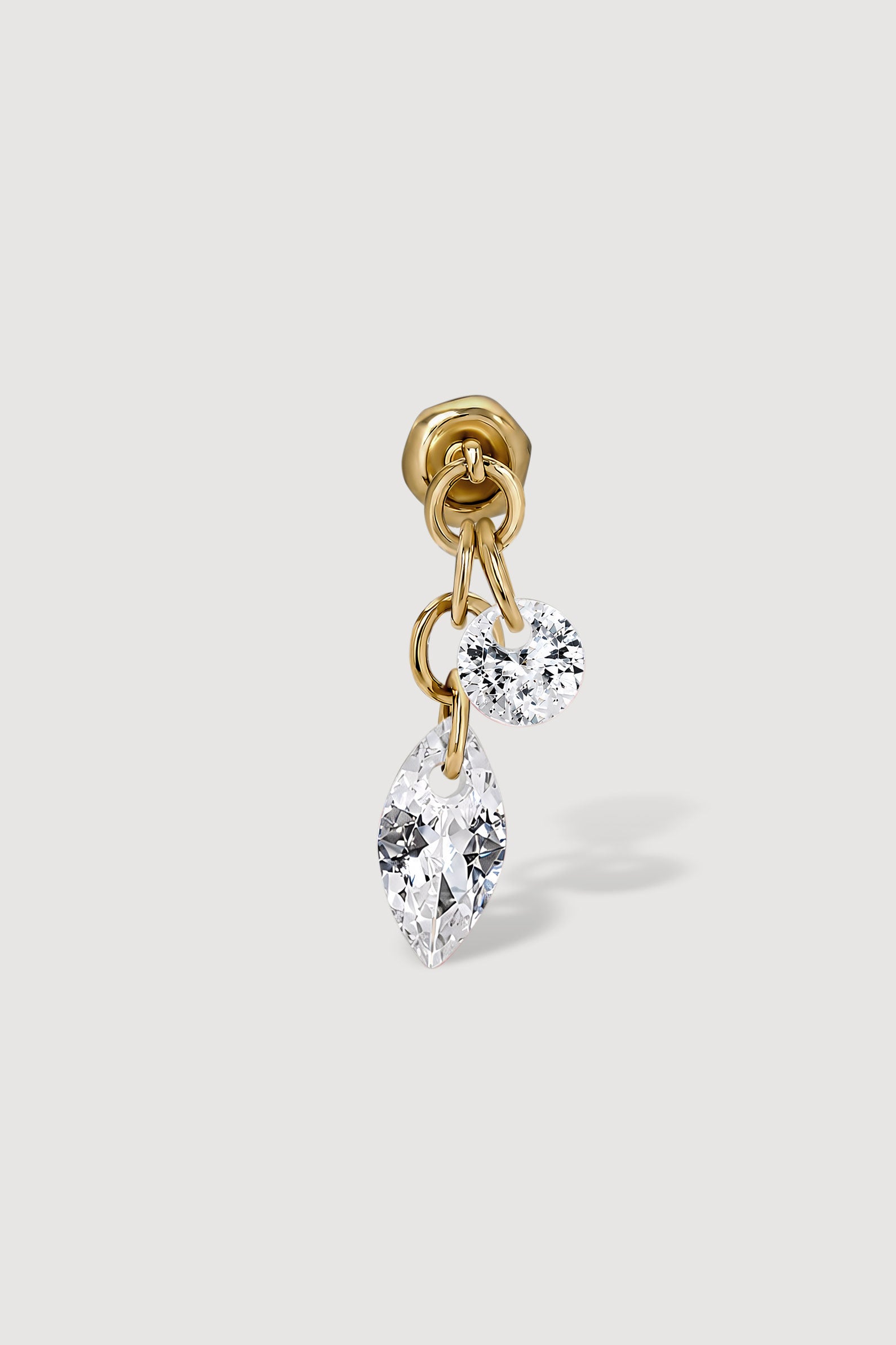 Gold earring with clear gemstones