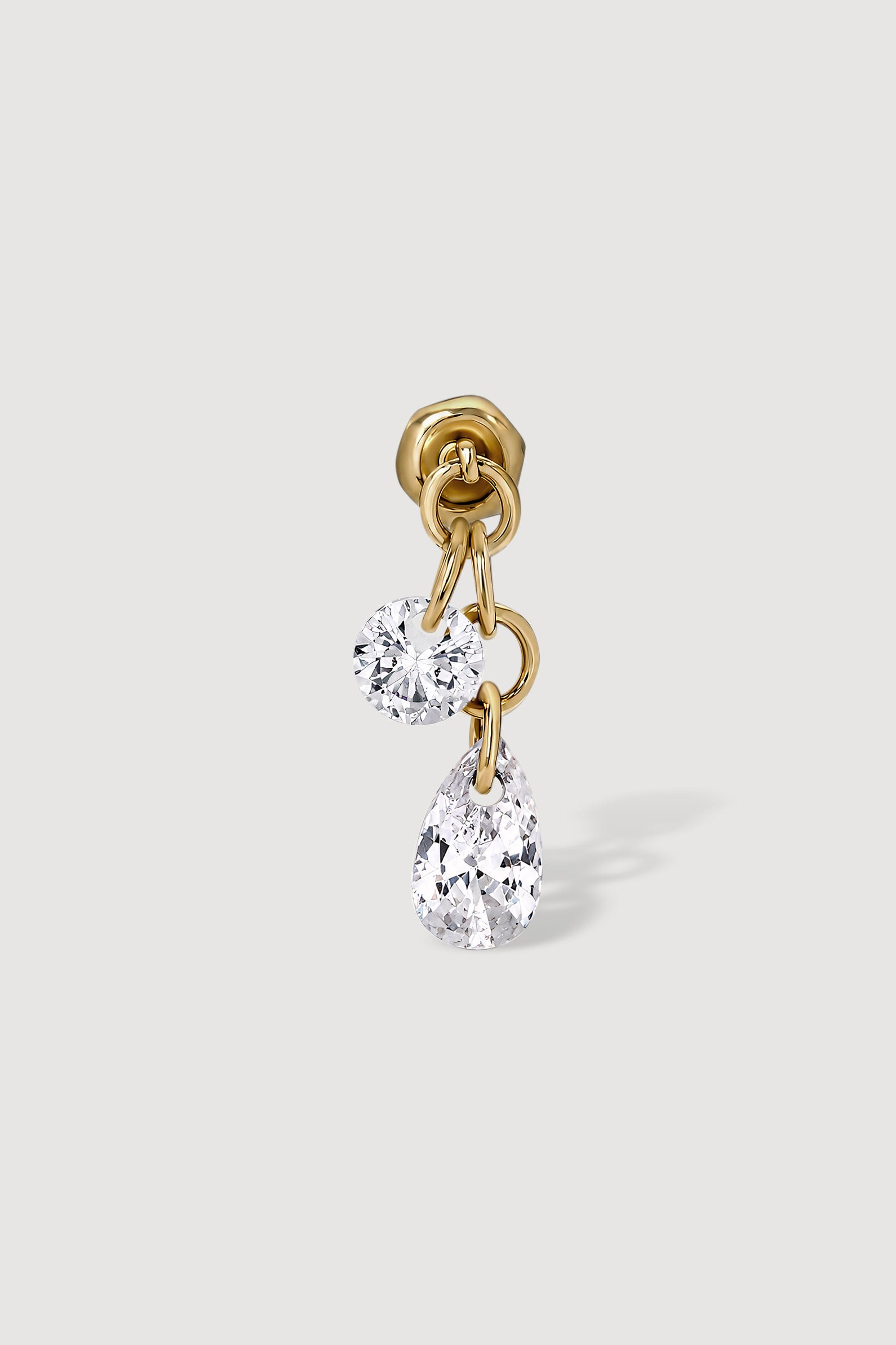 Gold earring with two cubic zirconia gems 