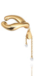 Gold-plaated designer ear cuff with a chain and gems on a white background