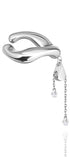 Silver accent ear cuff with transformable design on a white background