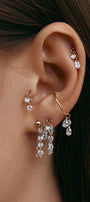 Curated ear composition with multiple modular earrings