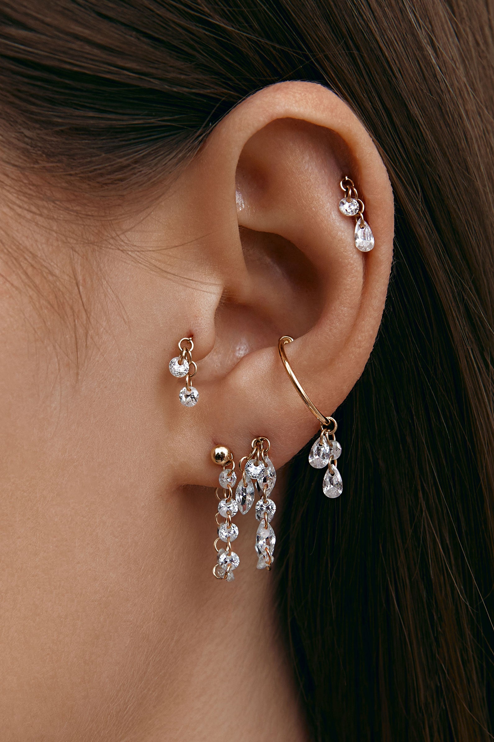 Curated ear composition with multiple modular earrings