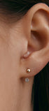 Minimalist gold earring with gem