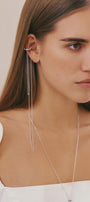 Girl in designer silver ear cuff with long chains