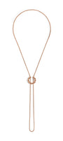 Gold necklace with a unique clasp design on a white background