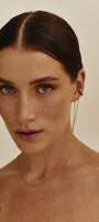 Woman wearing gold Sol cuff-necklace