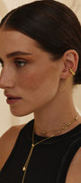 Girl in a set of gold transforming jewelry